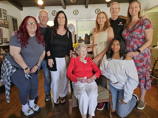 Family members of Gold Star mother Virginia Kelly surround her.